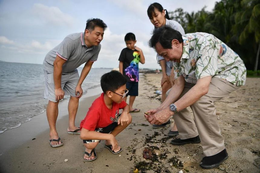(From left) Mr Eng Yong Liang with his sons Julian and Benjamin, wife Diana Chou and Emeritus Professor Chou Loke Ming at Changi Beach on June 7, 2022. ST PHOTO: ARIFFIN JAMAR