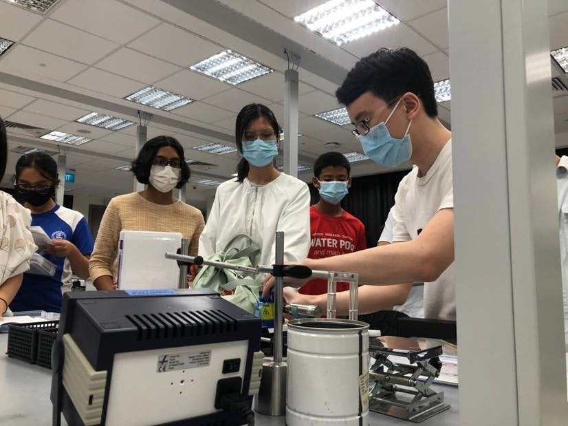 Zeyu (right) demonstrating physics experiments