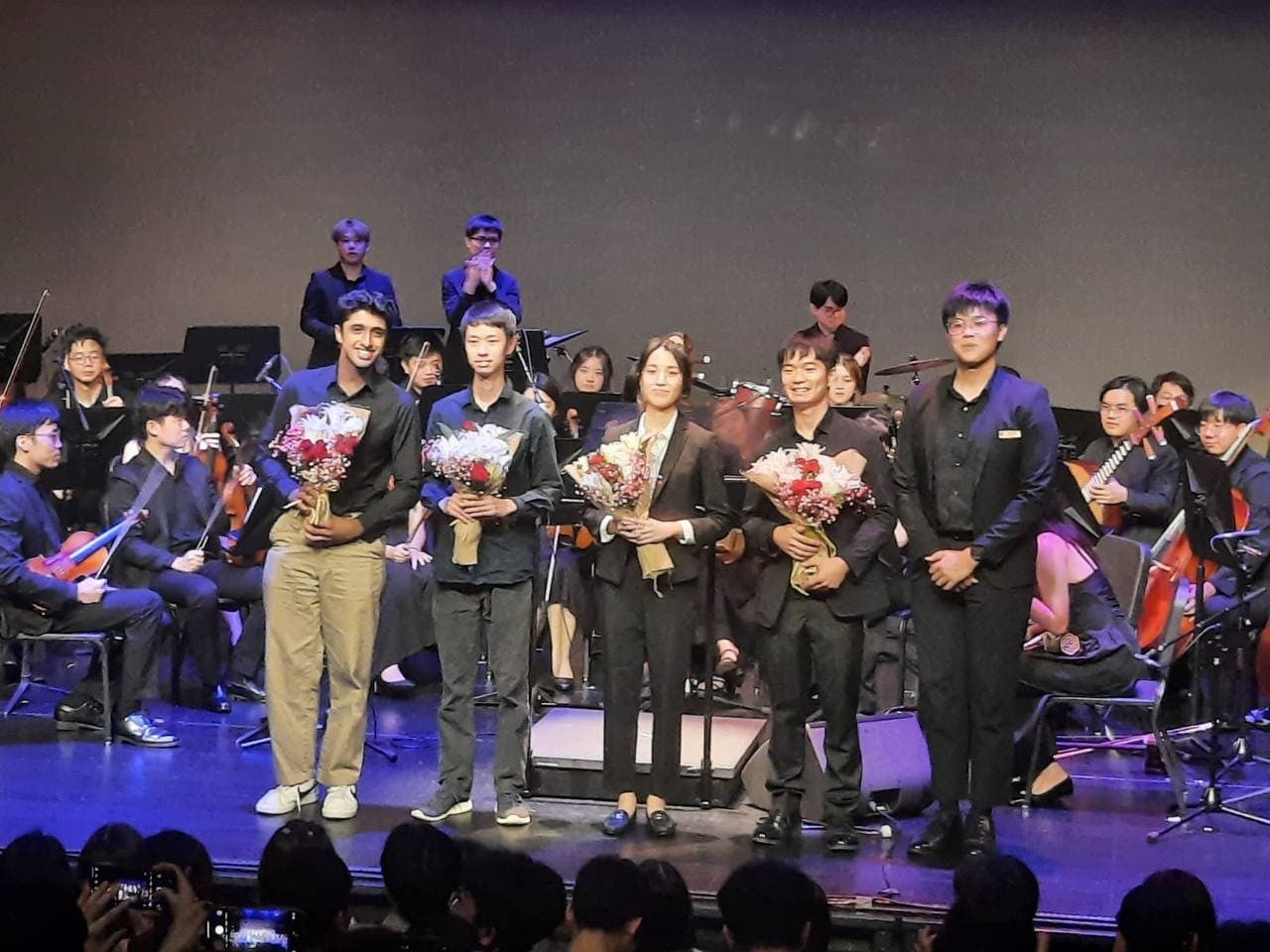 Combined Hall Ensemble Concert receiving flowers as Head of KEnsemble